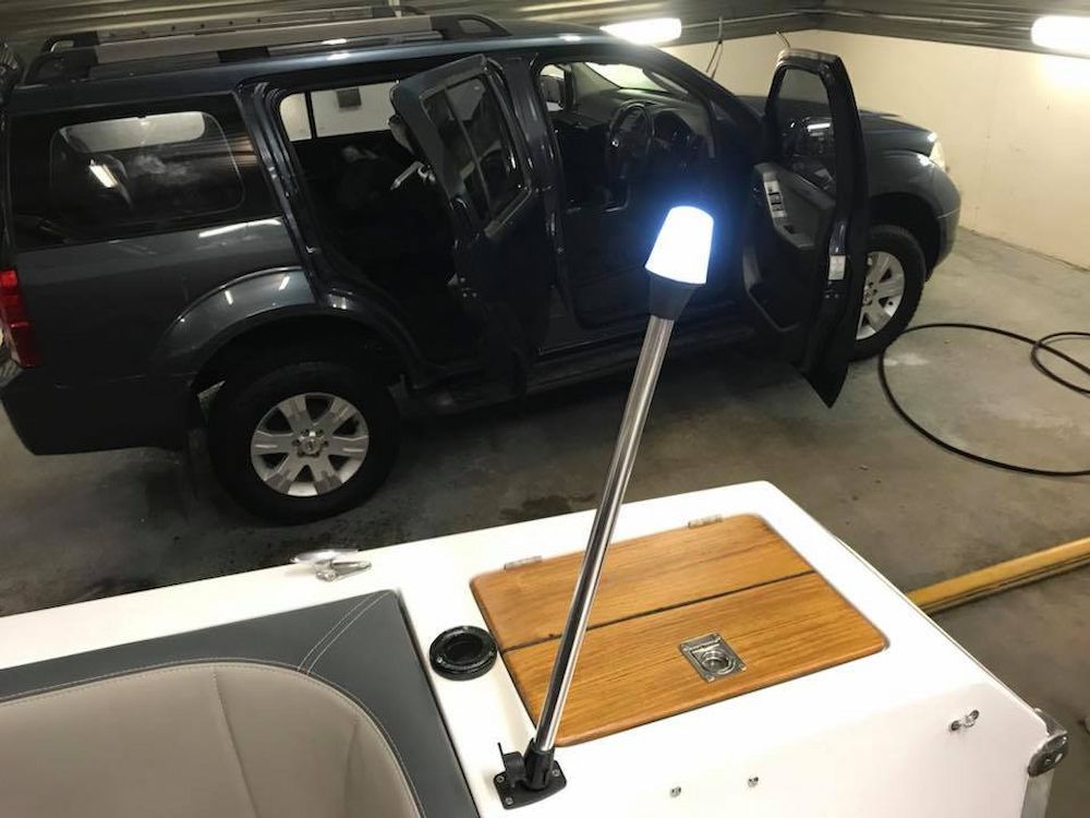 A Car is Parked in a Garage Next to a Boat — Adettra in Tuncurry, NSW