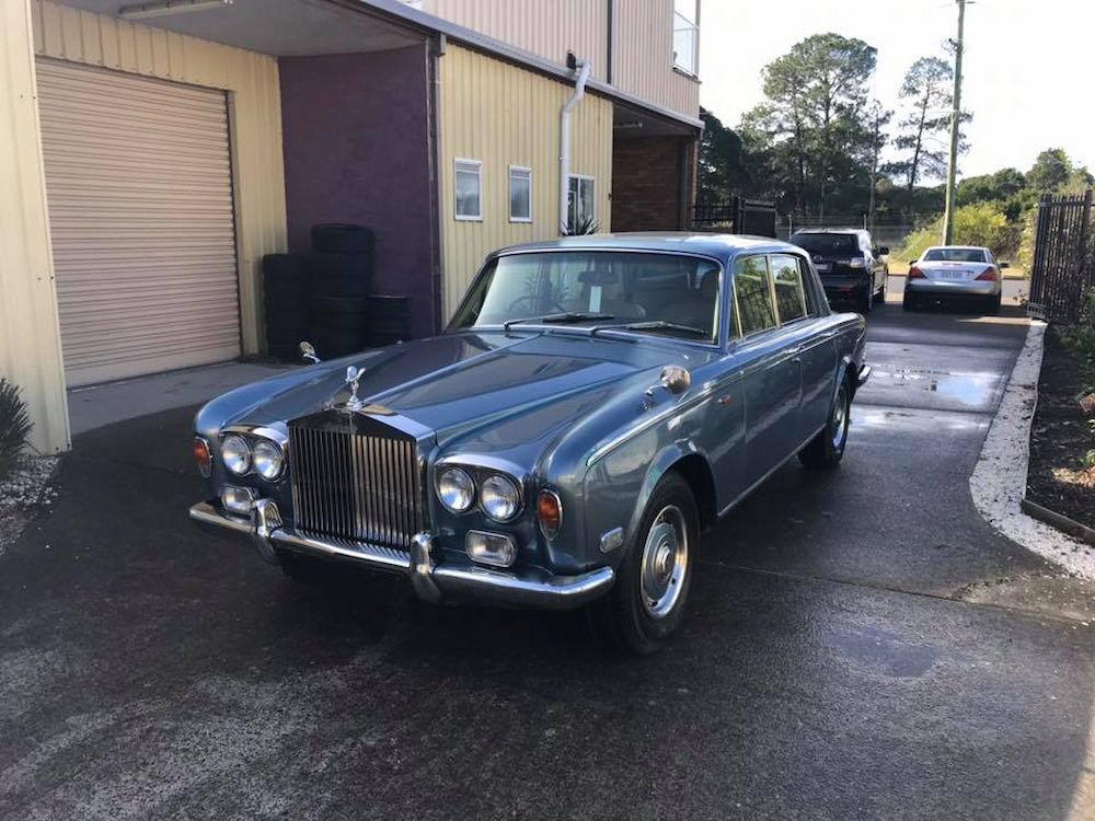 A Blue Rolls Royce is Parked in a Driveway — Adettra in Tuncurry, NSW