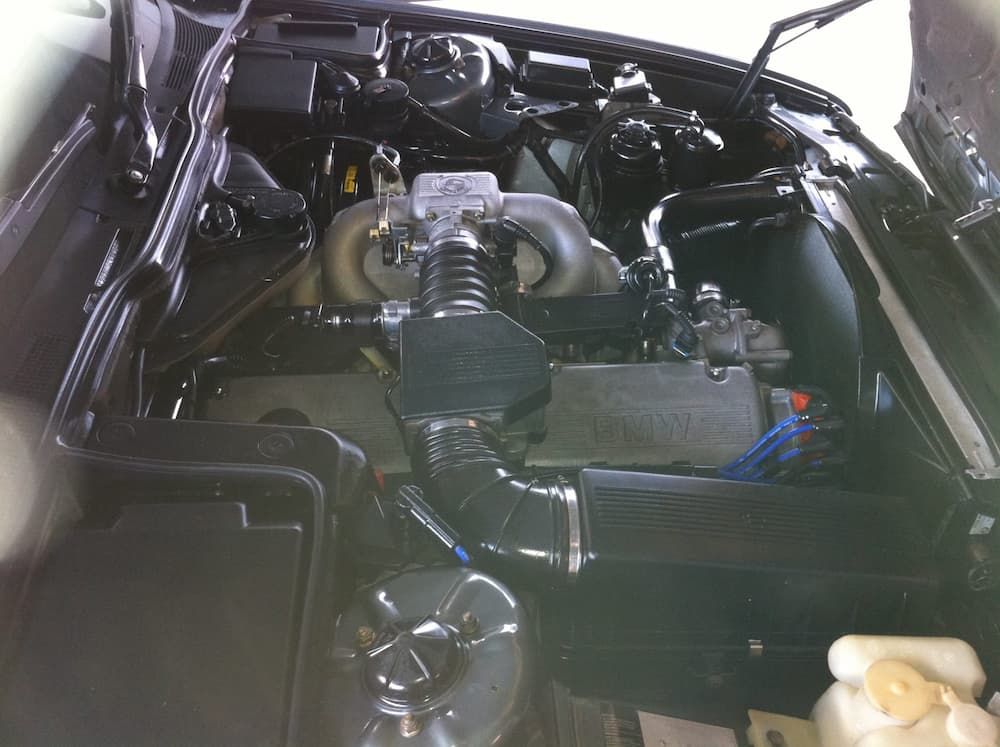 A Close Up of a Car Engine With the Hood Open — Adettra in Tuncurry, NSW
