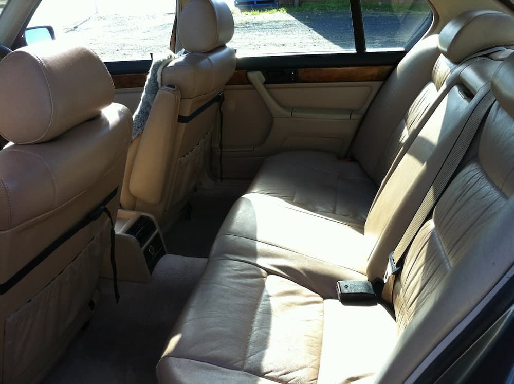 The Back Seat of a Car With Tan Leather Seats — Adettra in Tuncurry, NSW