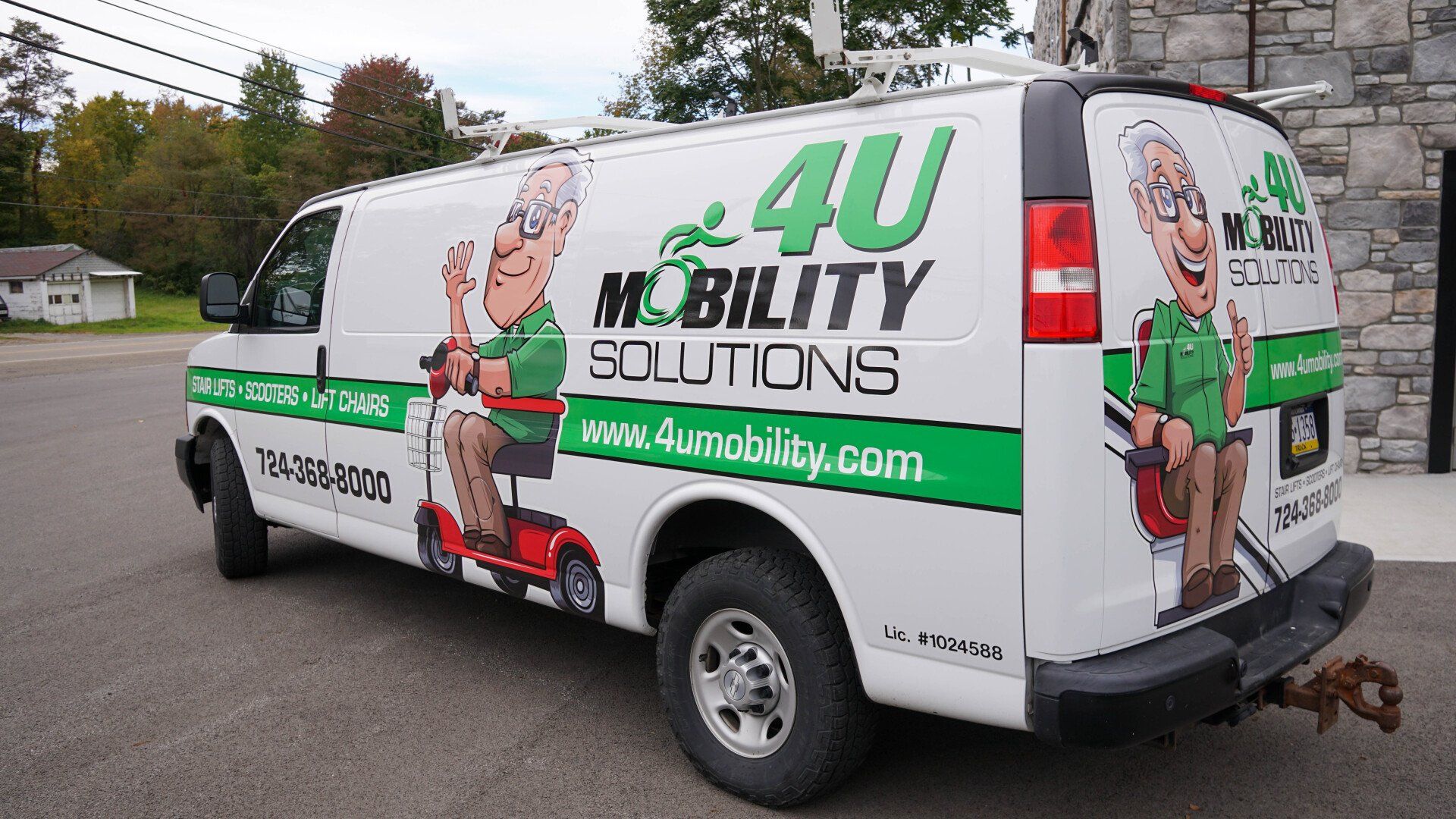 A 4u mobility solutions van is parked on the side of the road