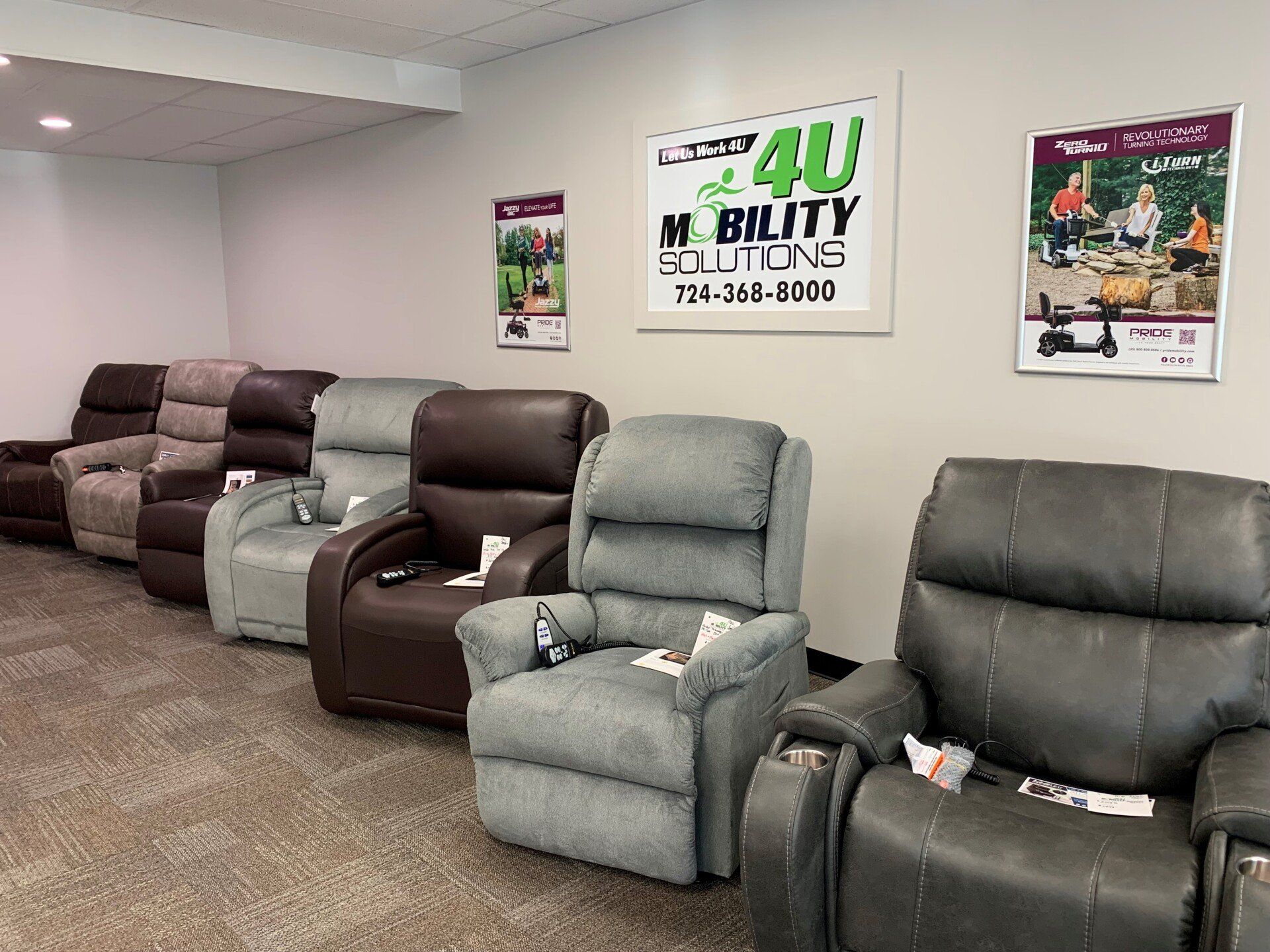 A row of recliner chairs are lined up in a room.