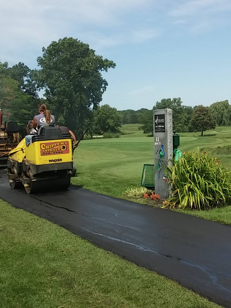 Man Driving The Roller Machine At The Pathway - Clio, MI - Chippewa Asphalt Paving