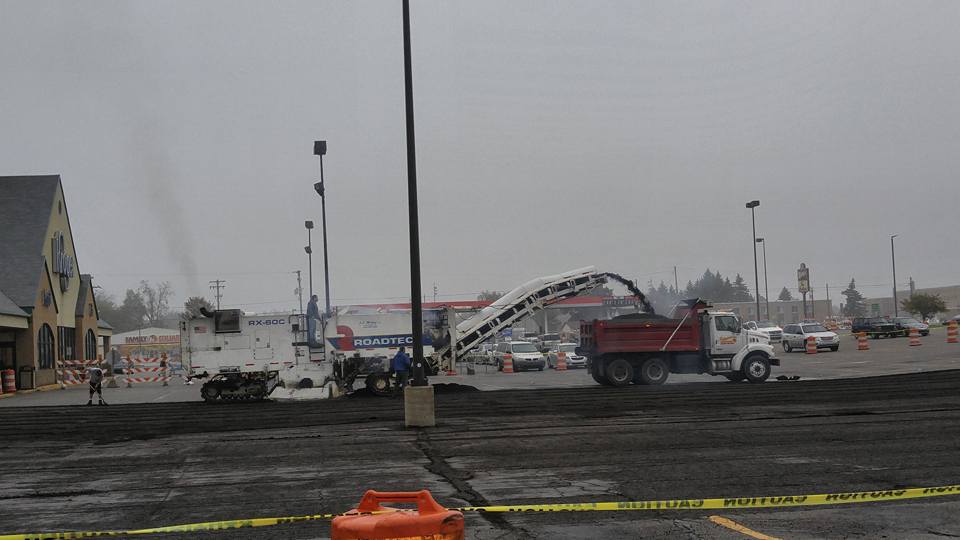Machine Passing Cement On The Truck - Clio, MI - Chippewa Asphalt Paving