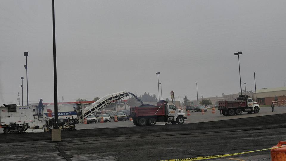 One Worker Getting Cement From One Of The Company Truck - Clio, MI - Chippewa Asphalt Paving