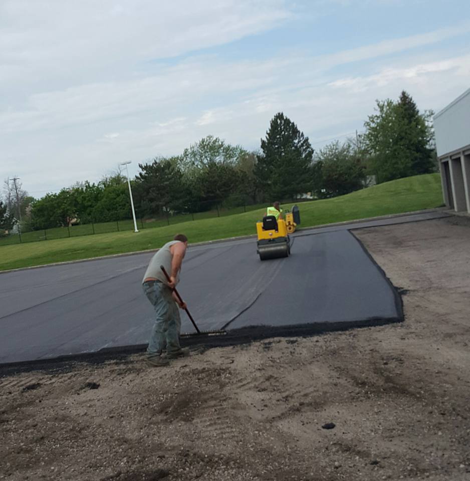 Two Workers Working On The Roadway - Clio, MI - Chippewa Asphalt Paving
