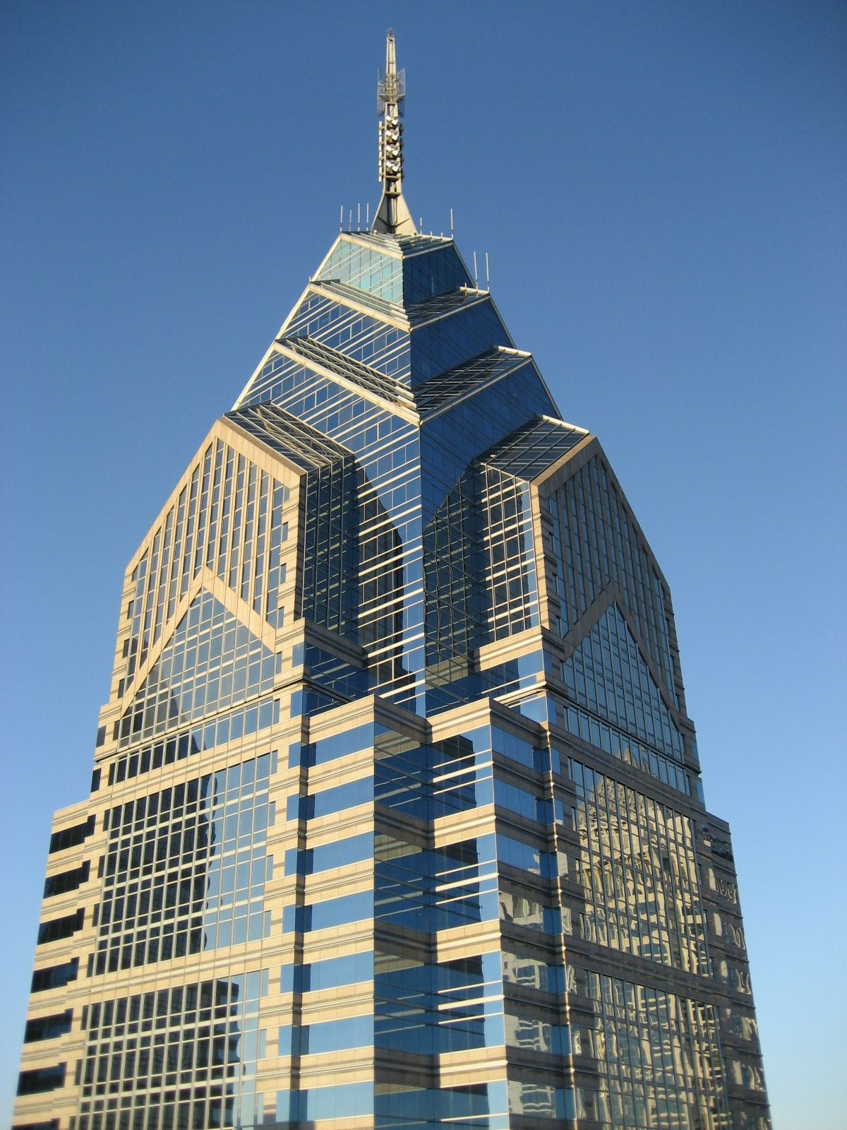 Blue-glass skyscraper with pyramid-like top in Philadelphia, Pennsylvania.