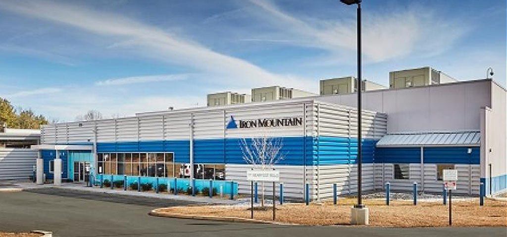 Exterior of a building with blue and white accents, featuring the 