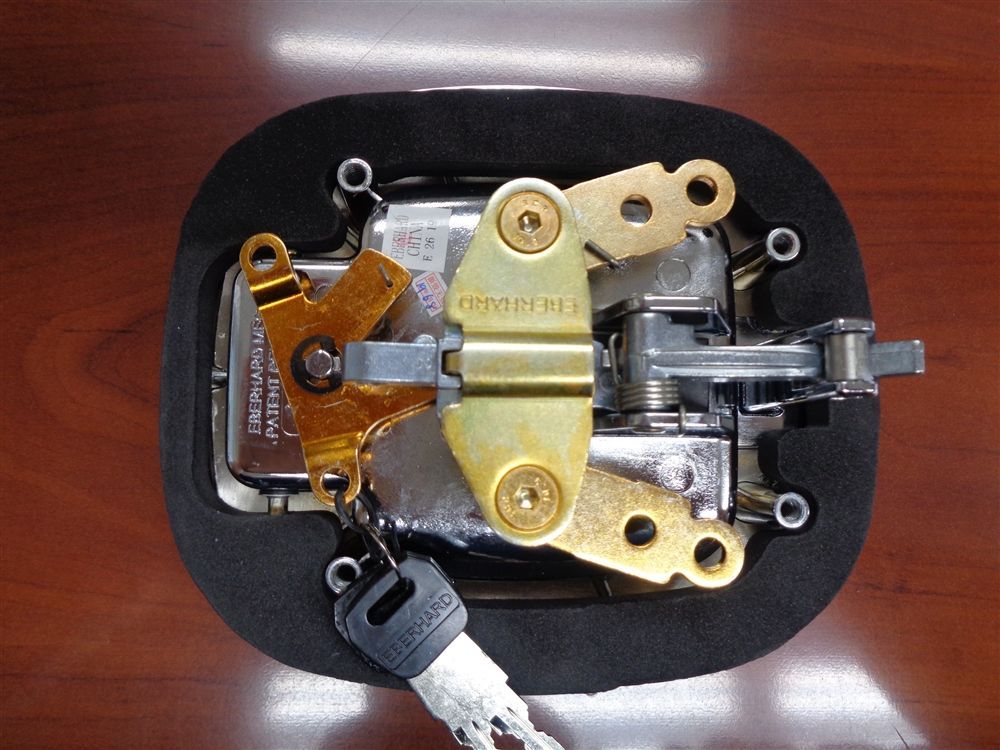 A stainless steel door handle on a white background