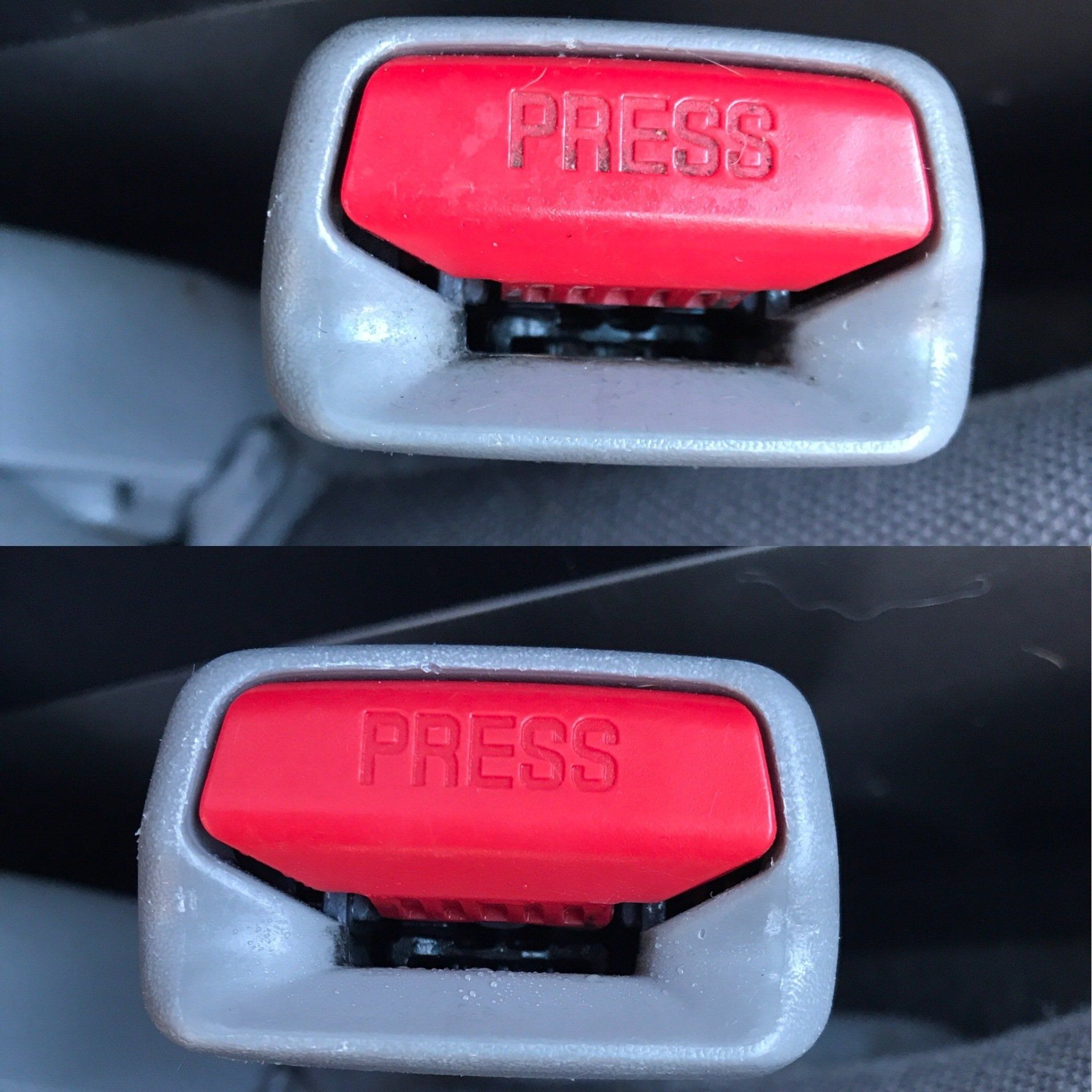 a red seat belt buckle with the word press on it