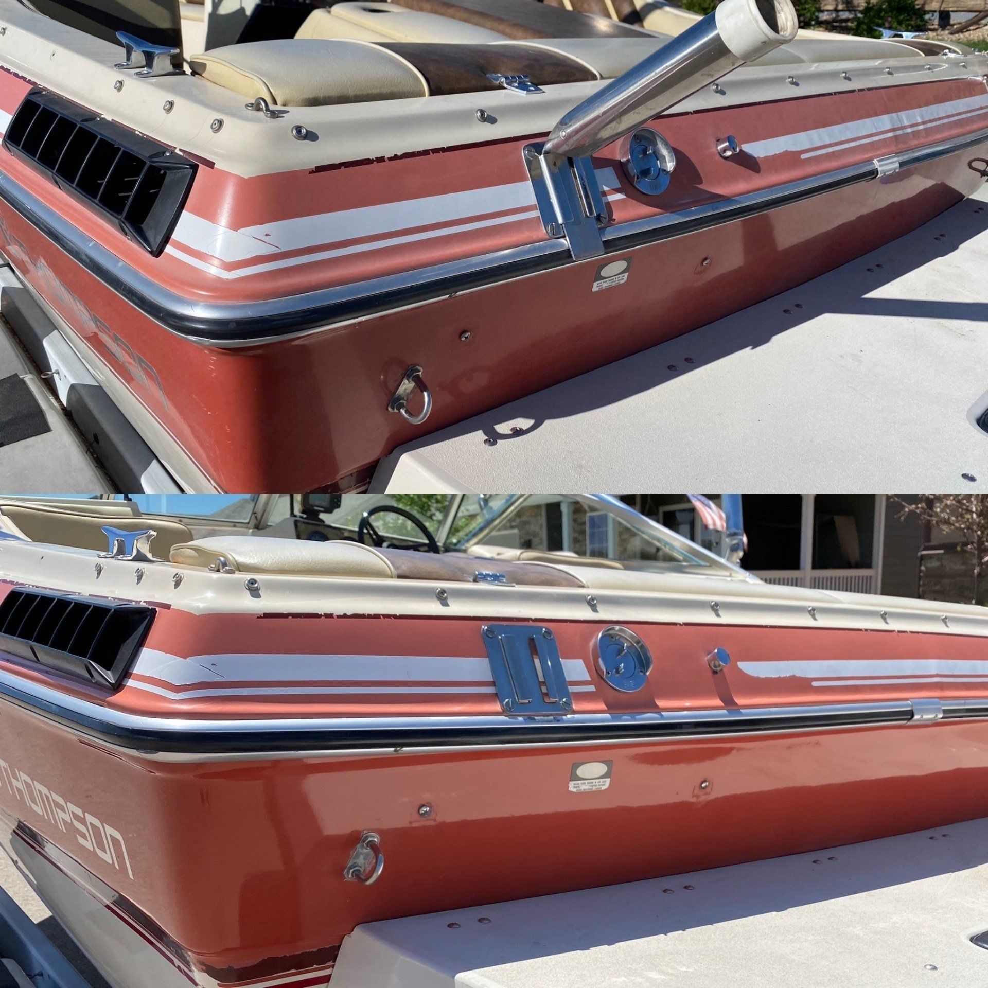 a red boat with a white stripe on the side