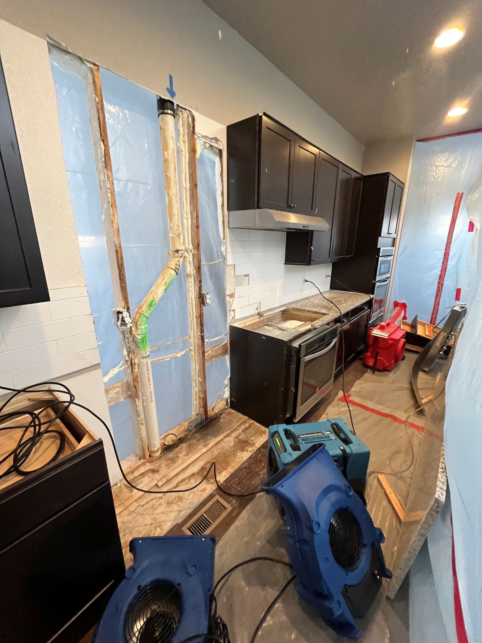 Kitchen water damage restoration in progress by HRS Restoration Services in Denver Colorado