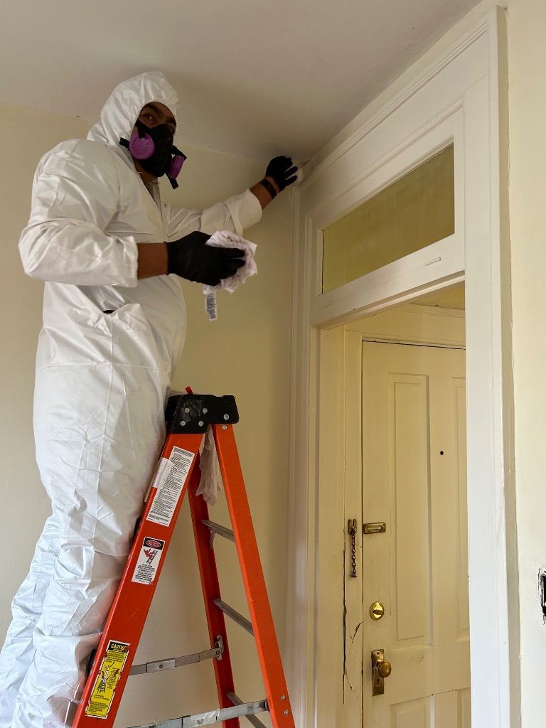 HRS Restoration Services professional in protective gear performing mold remediation in Denver Colorado