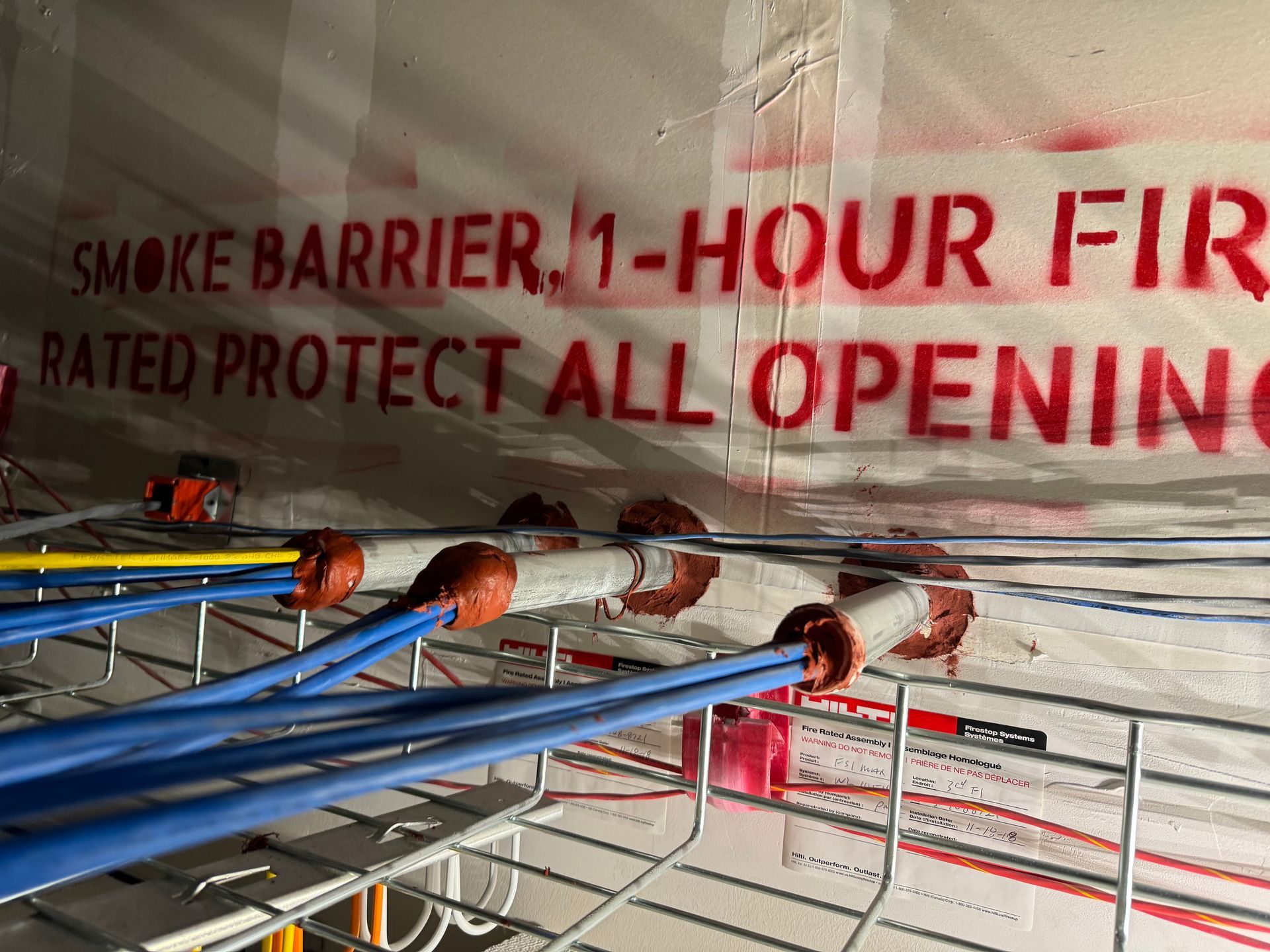 Fire-rated smoke barrier and cable penetration sealing by HRS Restoration Services in Denver Colorado