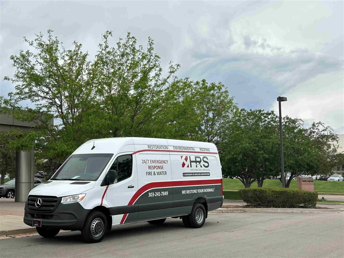 HRS Restoration Services Mercedes Sprinter van ready for 24/7 emergency response in Denver. Serving fire, water, and environmental restoration needs.