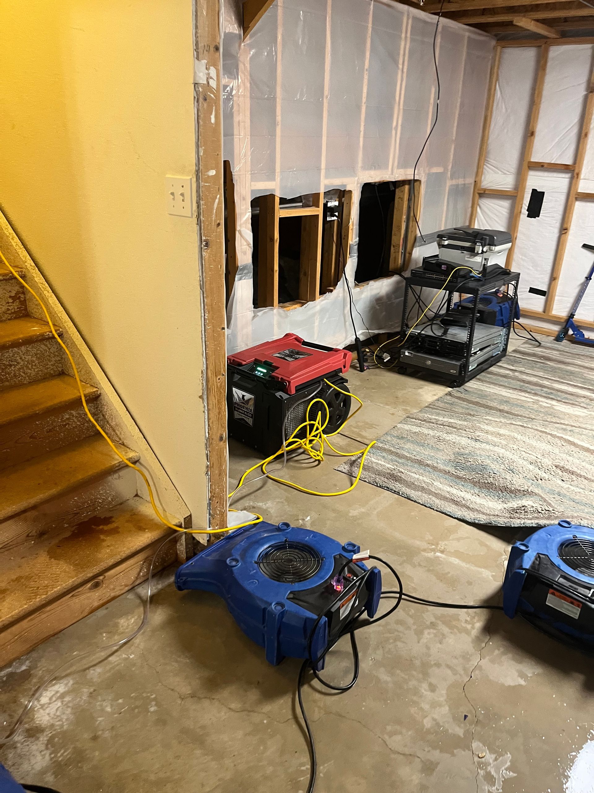 HRS Restoration Services using industrial fans for basement water damage drying in Denver Colorado