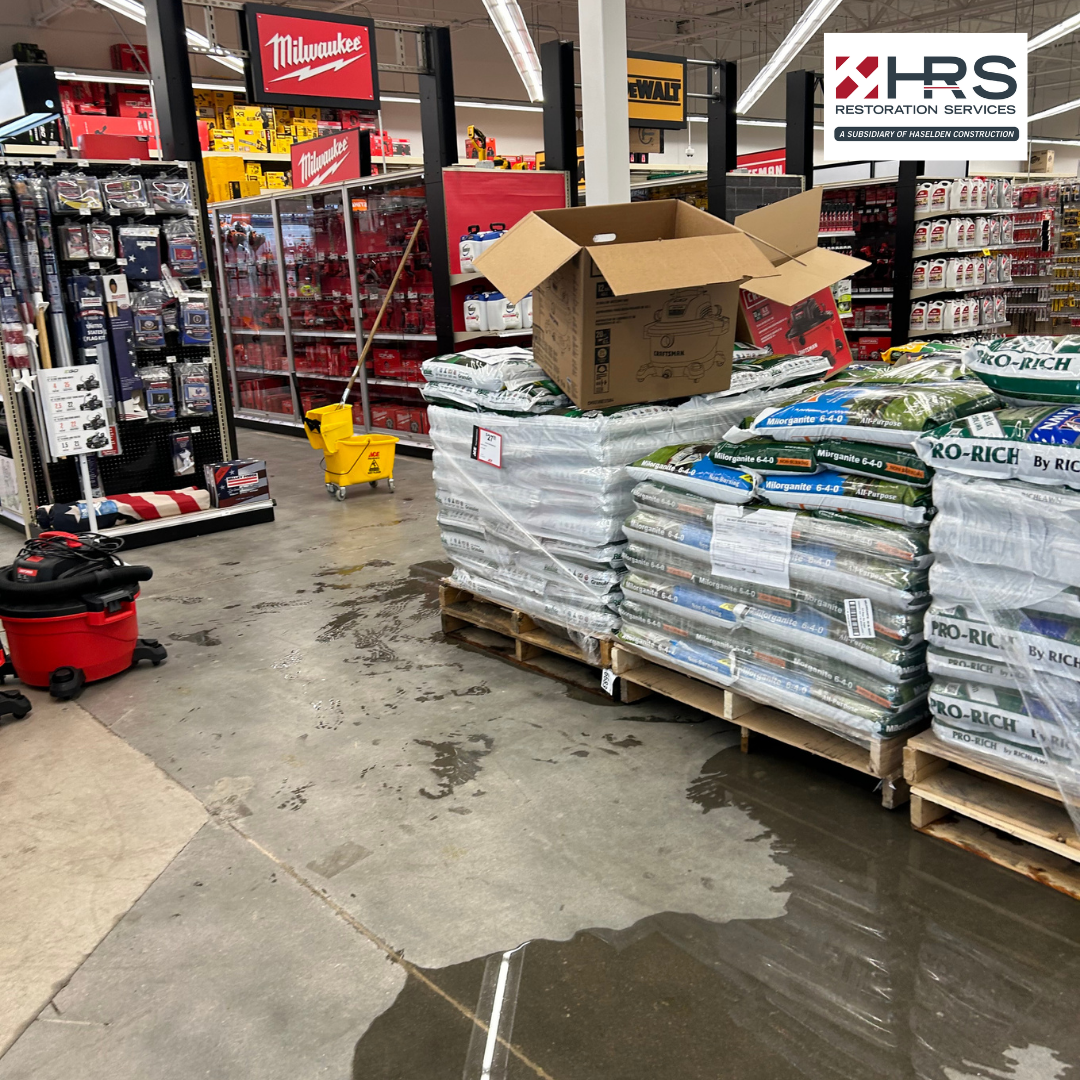 Standing water on a retail store floor after a water damage incident in Highlands Ranch CO