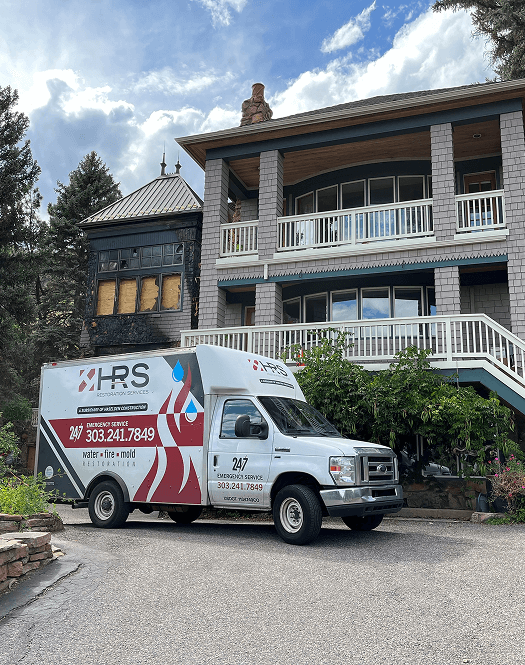 HRS Restoration Services emergency response truck at a Denver Colorado home