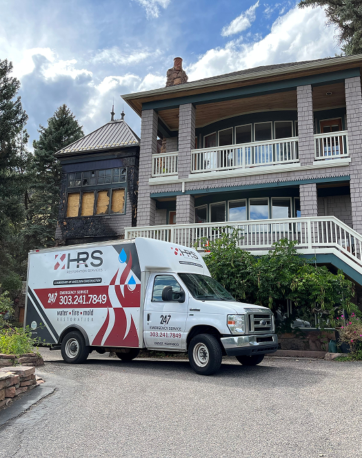 HRS Restoration Services emergency response truck at a Denver Colorado home