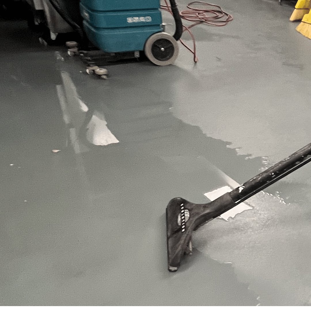 HRS Technician performing professional water extraction on a flooded floor during water damage cleanup in Colorado Springs