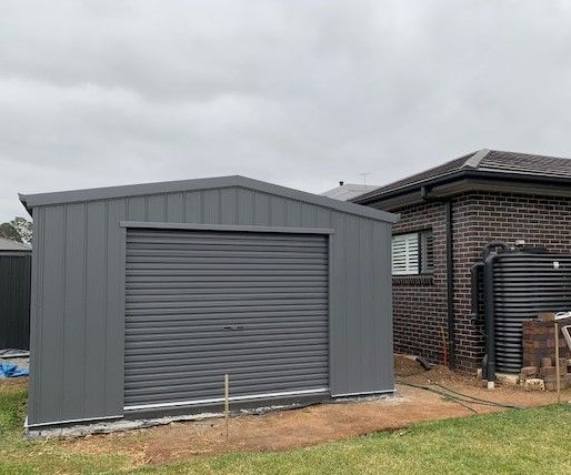 Single Garage Next To Brick Home — ShedPro Constructions in Smiths Lake, NSW