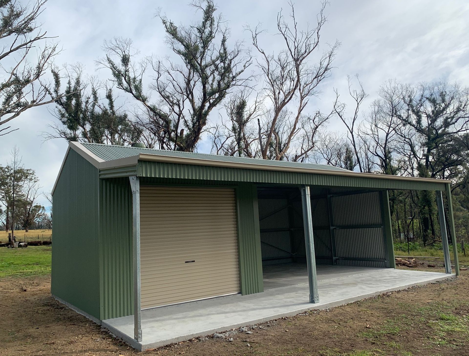 Single Green Rural Garage With Open Bay Brim — ShedPro Constructions in Bulahdelah, NSW