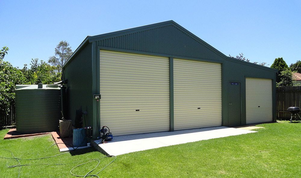 A Red Barn and Silo in A Field — ShedPro Constructions in Forster, NSW