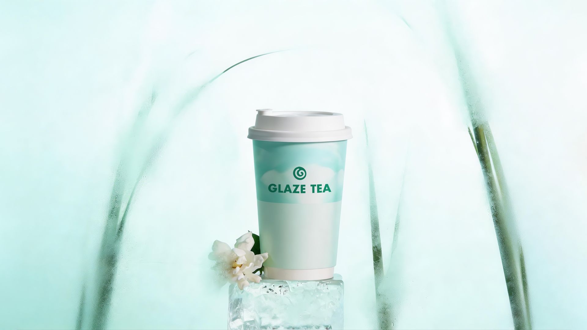 A cup labeled Glaze Tea sits on a clear ice block with a white flower, set against a soft, abstract teal background.