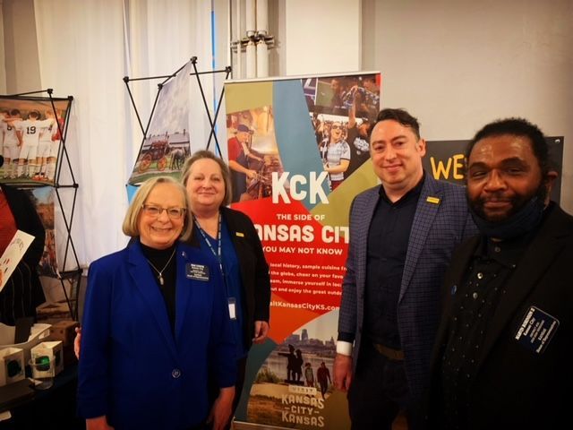 TIAK (Travel Industry in Kansas) Legislative Reception with Rep Marvin Robinson, Alan Carr, Executive Director of Visit KCK and Bridgette Jobe, Kansas Tourism Director in front of the KCK exhibit!