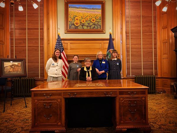 Legislative Pages Selah, Maggie, and Emeline with Rep. Curtis and Governor Kelly