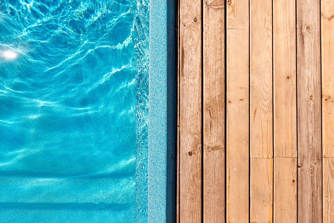 fiberglass pool with wooden deck