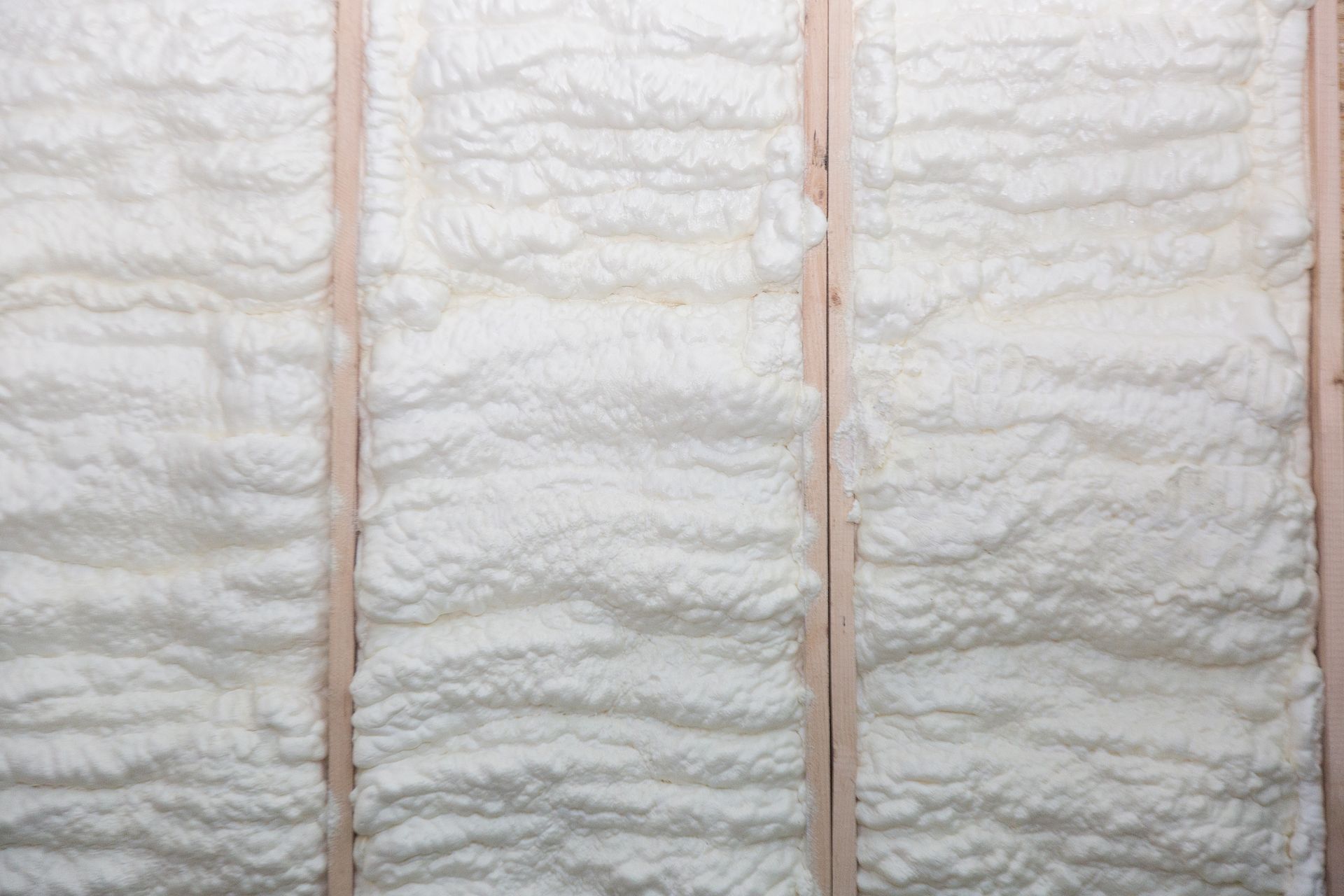 A close up of a wall with foam insulation on it.