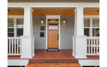 A photo of a porch that was built to the front of a local Henderson House. The porch is built securely and looks stunning.