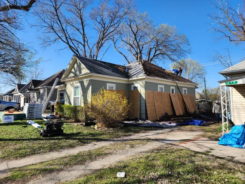 A house is being remodeled with a new roof.