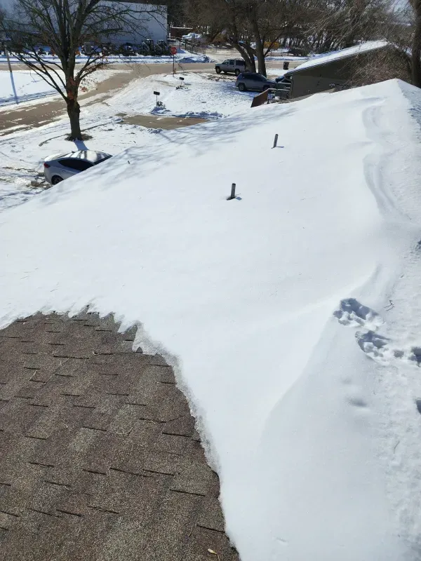 A roof with a lot of snow on it