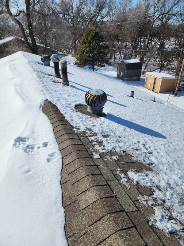 A roof with a lot of snow on it