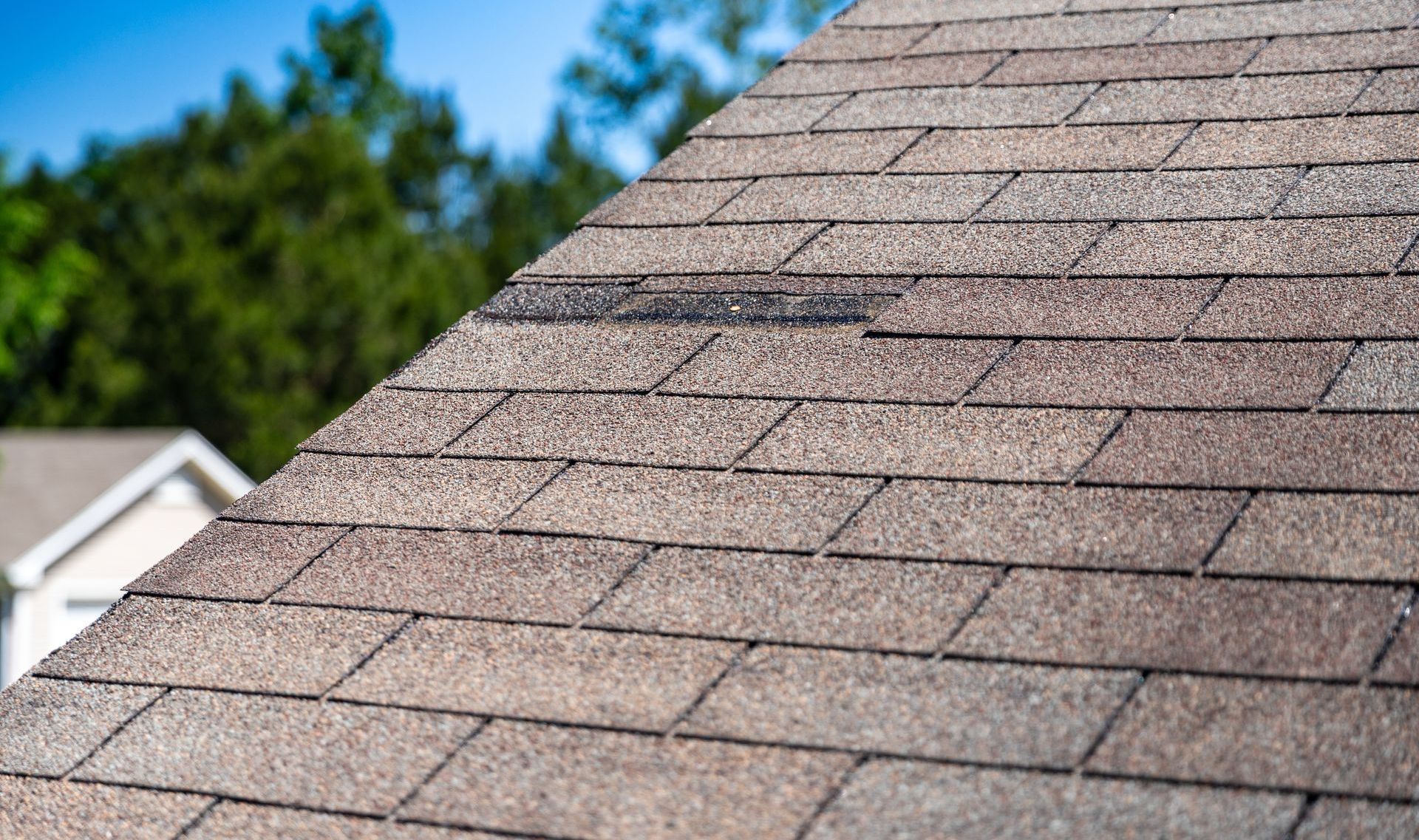 A close up of a roof with a lot of shingles on it.