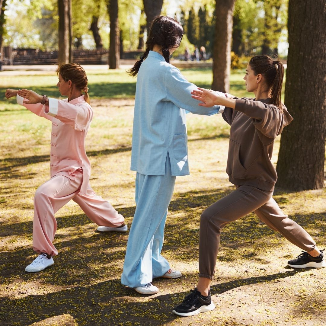 Two people practicing Brazilian Jiu-Jitsu on a mat. One is on top, applying a hold.