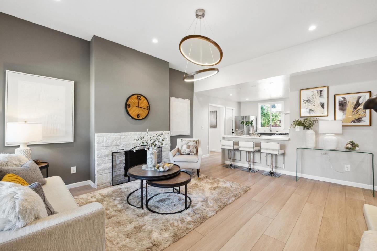 A living room filled with furniture and a fireplace.