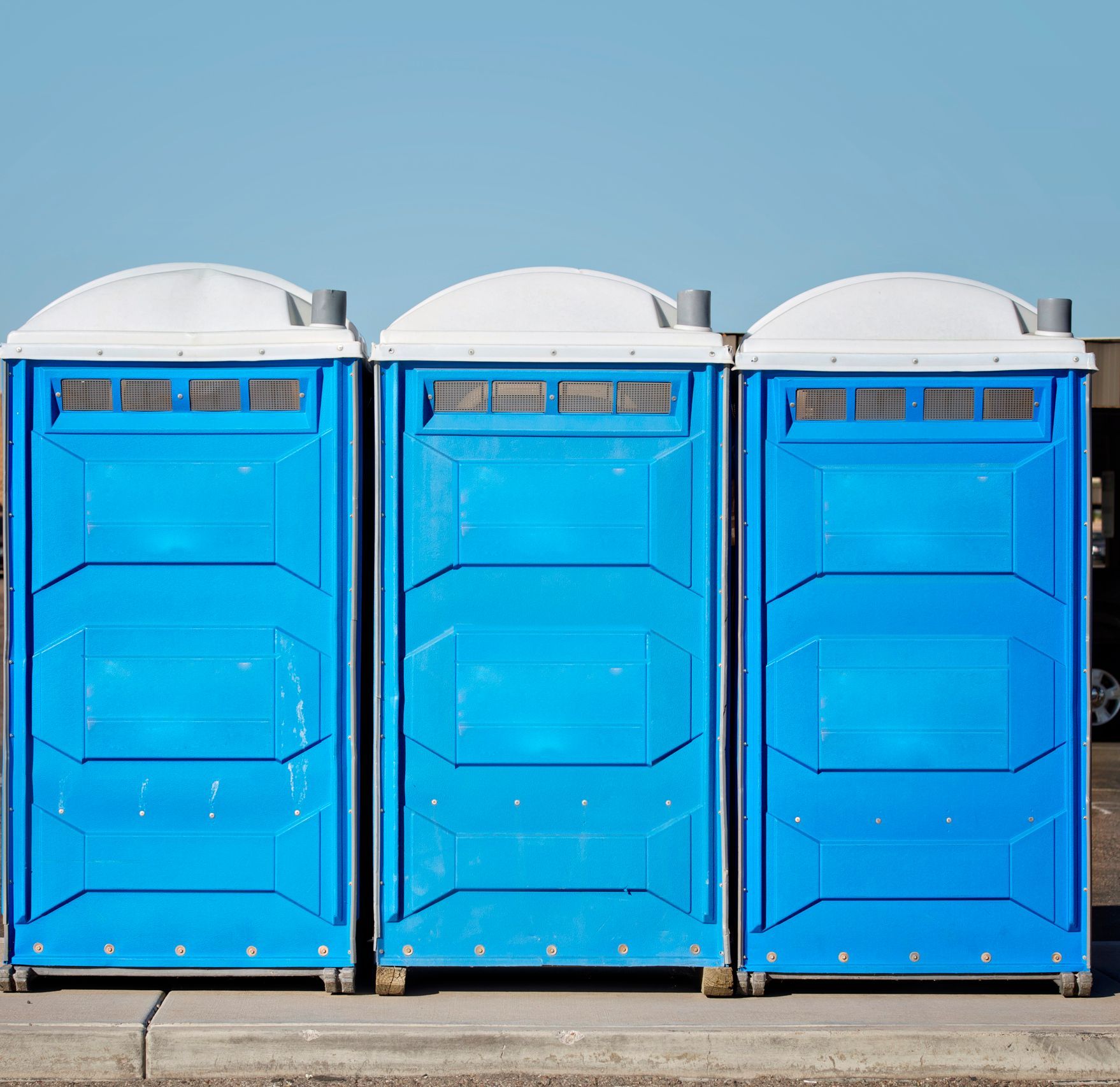 A row of three portable toilet bathroom on event site |GO HIRE SITE RENTALS | Bowral