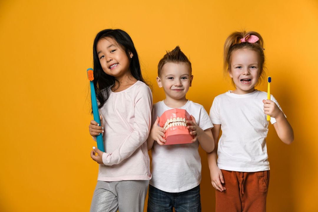 children with toothbrush in hand