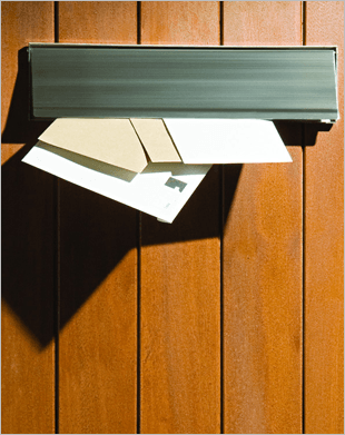 letters being posted through a door