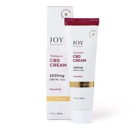 JOY CBD cream tube and box, white packaging with maroon accents, 1000 mg CBD oil formula