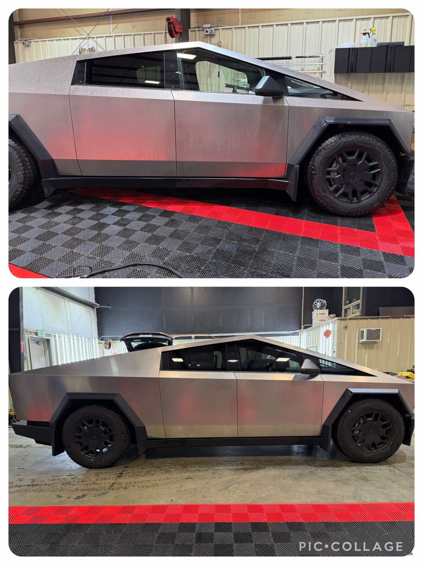 A tesla model s is parked in front of a garage.