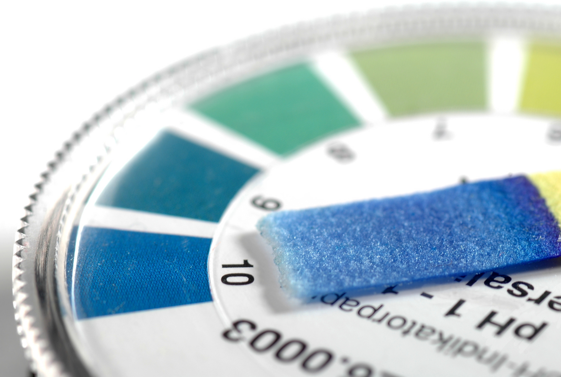 A close-up of a pH meter with a blue stripe on it