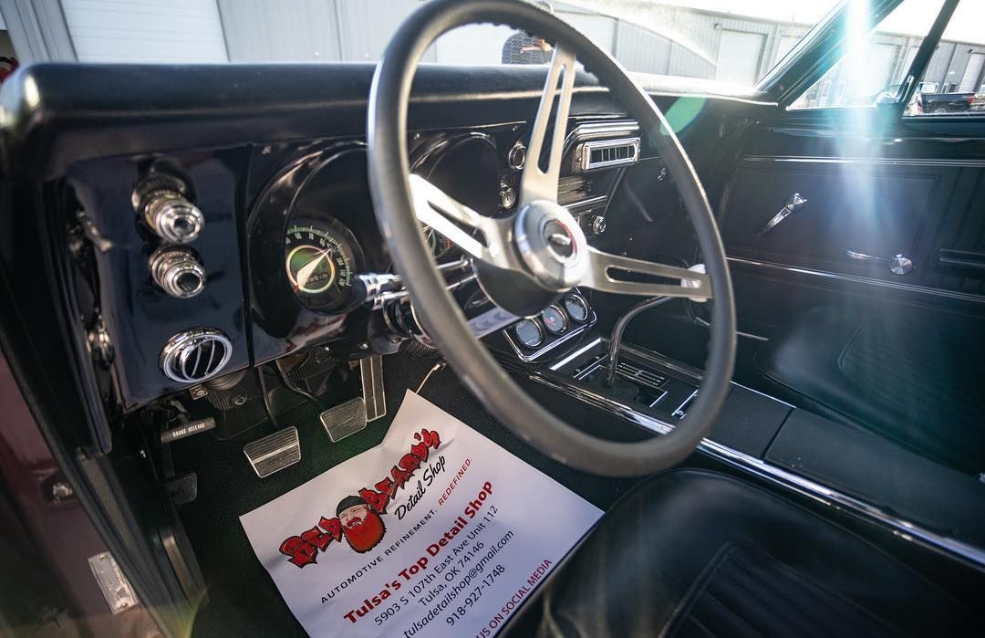 A close up of a steering wheel in a car