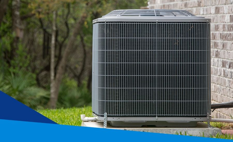 A large residential air conditioner is sitting on the side of a brick building in Campbell, CA.