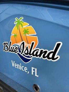 The back of a blue island venice fl boat