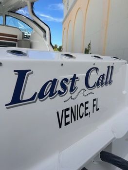 The name last call is on the side of a boat