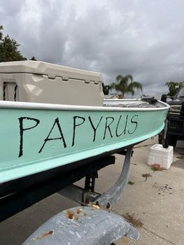 A boat with the name papyrus painted on the side